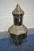 A MORROCAN BRASS HANGING LANTERN, with coloured glass panels, diameter 22cm x height 55cm (condition