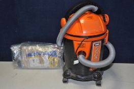 A VAX VO-4000 vacuum cleaner with a number of replacement dust bags no pole or brush bar (PAT pass