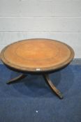 A CIRCULAR REPRODUCTION MAHOGANY TRIPOD COFFEE TABLE, with a brown leather skiver, diameter 91cm x