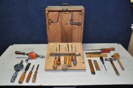 A BESPOKE WOODEN TOOLBOX containing various woodworking tools, saws, chisels, screwdrivers, manual