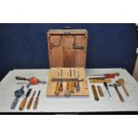 A BESPOKE WOODEN TOOLBOX containing various woodworking tools, saws, chisels, screwdrivers, manual