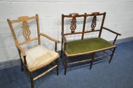AN EDWARDIAN TWO PIECE PARLOUR SUITE, comprising a sofa and an armchair (condition:-chair seat