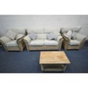 A WICKER FOUR PIECE LOUNGE SUITE, with floral cream and duck egg coloured cushions, comprising a two