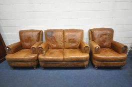 A BROWN LEATHER THREE PIECE SUITE, comprising a two seater sofa, length 140cm and a pair of armchair