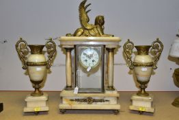 AN EARLY 20TH CENTURY ONYX AND GILT METAL CLOCK GARNITURE, the clock with winged sphinx surmount