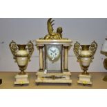 AN EARLY 20TH CENTURY ONYX AND GILT METAL CLOCK GARNITURE, the clock with winged sphinx surmount