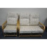 A WICKER TWO PIECE SUITE, comprising of a two seater sofa and an arm chair with beige floral