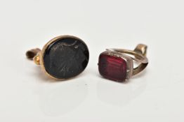TWO CARVED FOB SEALS, the first a 9ct gold fob seal with oval onyx panel carved to depict a
