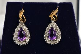 A PAIR OF AMETHYST AND DIAMOND CLUSTER DROP EARRINGS, each designed as a pear shape cluster, the