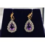 A PAIR OF AMETHYST AND DIAMOND CLUSTER DROP EARRINGS, each designed as a pear shape cluster, the