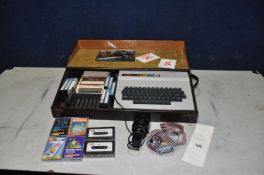 A DRAGON 64 VINTAGE GAMING COMPUTER in bespoke wooden case with power supply, a Bush Datasette,