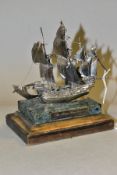 A LIMITED EDITION SILVER MODEL OF THE MARY ROSE, mounted on an onyx and mahogany plinth, makers St