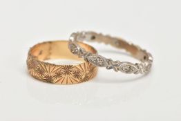 A 9CT GOLD BAND RING AND A WHITE METAL DIAMOND ETERNITY RING, the band textured with a diamond cut