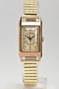 A 9CT GOLD WRISTWATCH, hand wound movement, gold rectangular dial, Arabic numerals, central