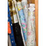 EIGHT ROLLS OF ASSORTED UPHOLSTERY FABRIC, two plain cream, the others with floral patterned