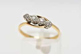 A YELLOW METAL FOUR STONE DIAMOND RING, designed with four illusion set single cut diamonds,