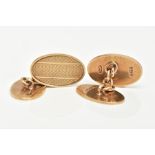 A PAIR OF 9CT GOLD ENGINE TURNED CUFFLINKS, each of an oval form, fitted together with curb links,