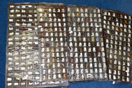 FOUR DISPLAY TRAYS CONTAINING APPROXIMATELY FIVE HUNDRED AND TEN THIMBLES, mainly ceramic