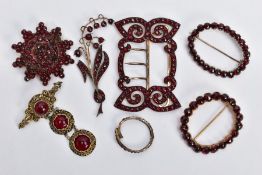 A SELECTION OF BOHEMIAN GARNET BROOCHES AND A BUCKLE, three brooches set with rose cut garnets