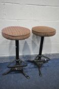 A PAIR OF CAST IRON PUB STOOLS, with foot rests, height 78cm