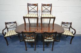A MAHOGANY TWIN PEDESTAL DINING TABLE, with a single leaf, extended length 180cm x closed length