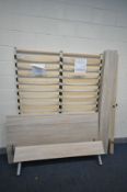 A LIGHT WOOD EFFECT 5FT BEDSTEAD, with two slatted bases