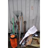 A COLLECTION OF GARDEN TOOLS including spades, tree loppers, an Eckman three piece long reach set (