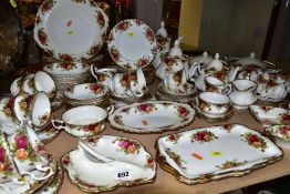 A ROYAL ALBERT OLD COUNTRY ROSES PATTERN DINNER SERVICE, comprising two twin handled circular