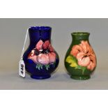 TWO MOORCROFT POTTERY VASES, comprising a globe shaped vase with cylindrical neck decorated with