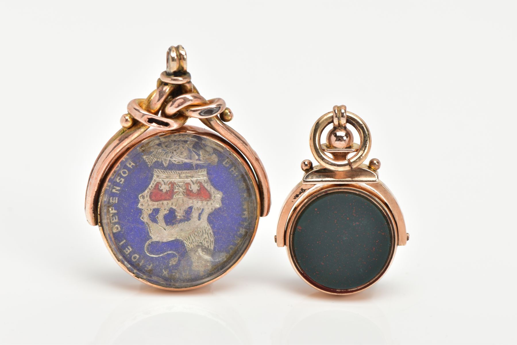 TWO 9CT GOLD SWIVEL FOBS, the first a bloodstone and carnelian fob in a polished gold mount,