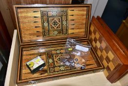 A MARQUETRY AND MOTHER OF PEARL INLAID BACKGAMMON AND CHESS BOARD WITH OTHER GAMES, comprising a