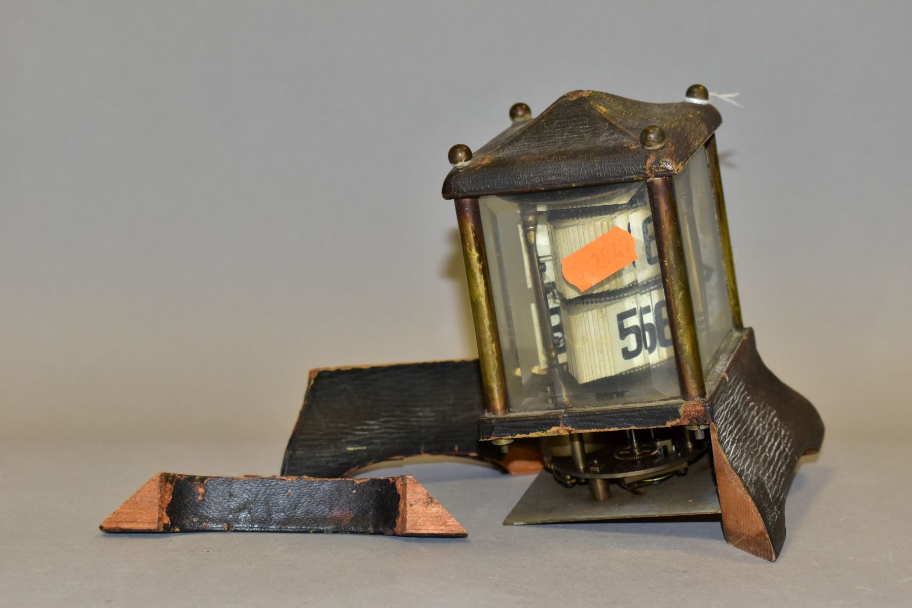 AN EDWARDIAN BRASS AND LEATHER CASED PERPETUAL CALENDAR, in an architectural case, lacks finial, the - Image 2 of 8