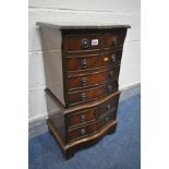 A SMALL REPRODUCTION MAHOGANY CHEST ON CHEST, of eight drawers, width 42cm x depth 33cm x height