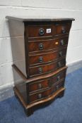A SMALL REPRODUCTION MAHOGANY CHEST ON CHEST, of eight drawers, width 42cm x depth 33cm x height
