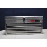 A METAL TOP TOOLBOX containing tools to include a number of socket sets, spanners, screwdrivers,