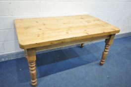 A PINE KITCHEN TABLE, on turned legs, length 153cm x depth 90cm x height 80cm