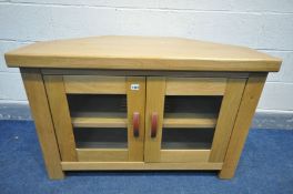 A SOLID OAK CORNER TV STAND with leatherette handles, width 106cm x depth 56cm x height 69cm (