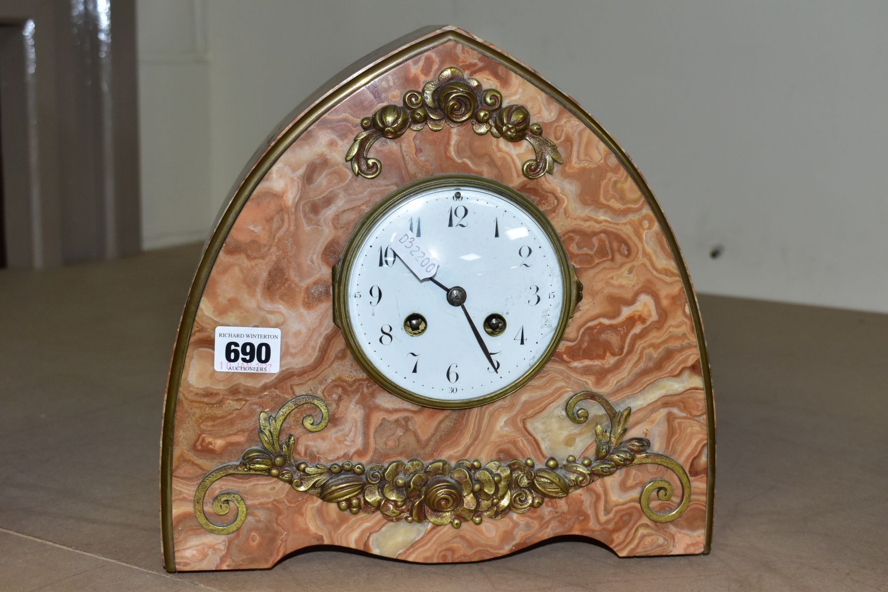 AN EARLY 20TH CENTURY JAPY FRERES ORANGE MARBLE ARCH SHAPED MANTEL CLOCK, the white enamel dial with