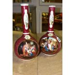 A PAIR OF VICTORIA AUSTRIA ONION SHAPED VASES, featuring classical scenes on a deep red ground