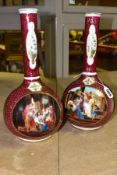 A PAIR OF VICTORIA AUSTRIA ONION SHAPED VASES, featuring classical scenes on a deep red ground