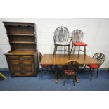 A 20TH CENTURY OAK DRAW LEAFT TABLE on acorn supports united by twin stretchers, open width 167cm