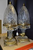 A PAIR OF KLEIN BACCARAT CRYSTAL TABLE LAMPS, with a diamond cut crystal body on a brass base,