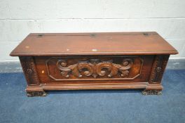 A STAINED MAHOGANY BLANKET CHEST, with a foliate carved front, width 130cm x depth 43cm x height