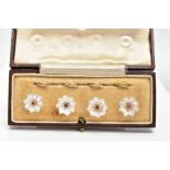 A SET OF ROCK CRYSTAL AND RUBY DRESS STUDS, four dress studs comprising of rock crystal flowers