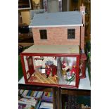 A DOLLS HOUSE AND MINIATURE TOY SHOP, comprising a modern/late twentieth century dolls house with