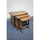 AN ERCOL ELM NEST OF THREE TABLES, largest table width 57cm x depth 35cm x height 43cm