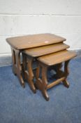 AN ERCOL ELM NEST OF THREE TABLES, largest table width 57cm x depth 35cm x height 43cm