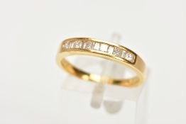 AN 18CT GOLD DIAMOND HALF ETERNITY RING, designed with a row of channel set, princess cut and