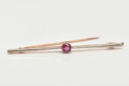 A TOURMALINE BAR BROOCH, a circular cut tourmaline in a nine prong basket setting, affixed to a