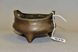 A CHINESE BRONZE TRIPOD CENSER, bears character marks to the base, height 7cm x diameter 10cm